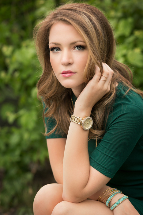 Happy high school senior posing in an urban downtown setting in Fort Collins Colorado