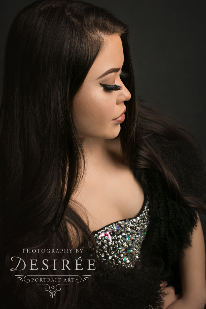 profile photo of beautiful girl in a formal gown and fur with amazing makeup
