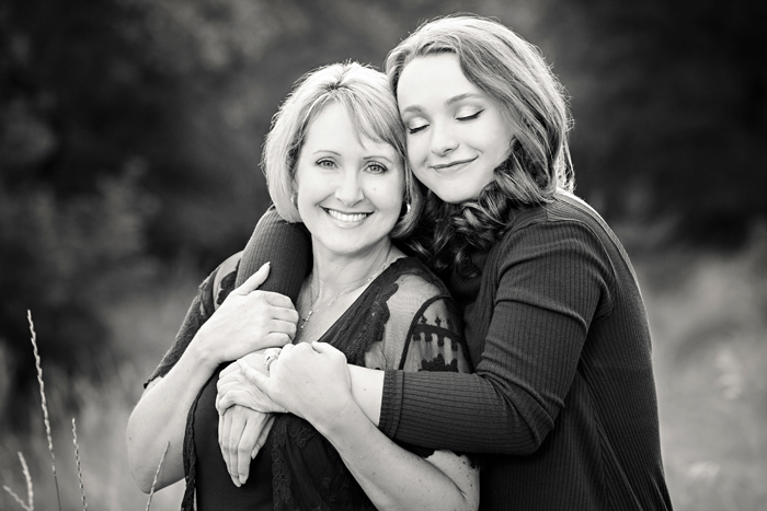 black and white of daughter hugging mother