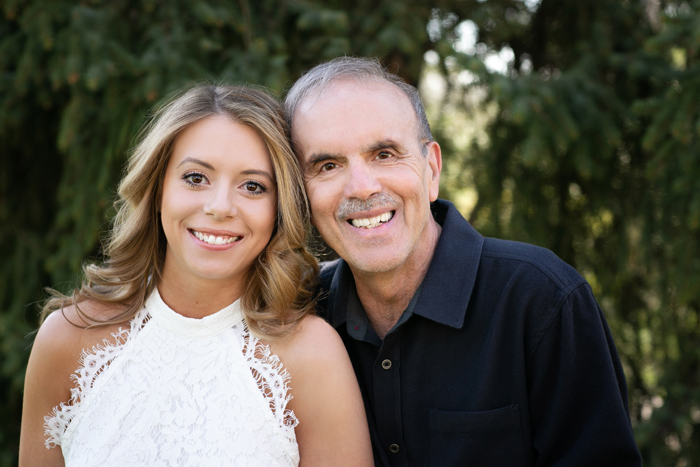 a daughter and dad portrait outside
