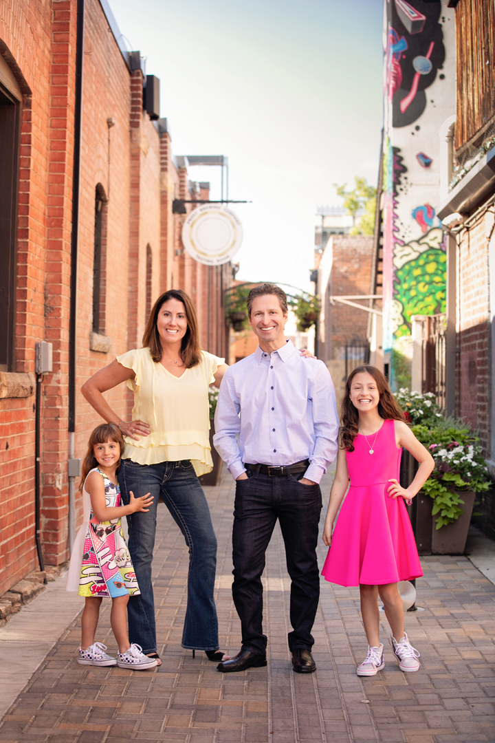 Family photo session image taken in an urban scene in Fort Collins, Colorado.