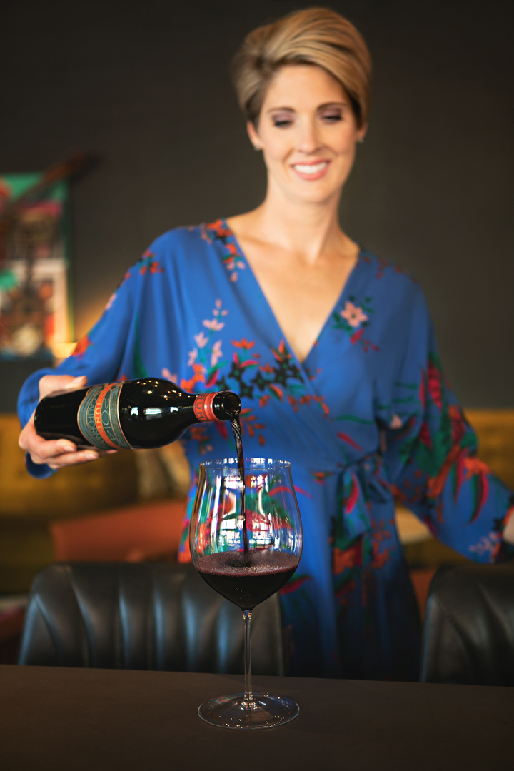 personal branding portrait of a sommelier pouring wine
