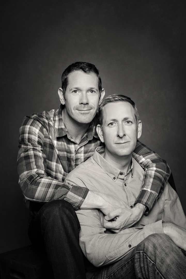Same sex couple in an embrace taken in the studio located in south fort collins