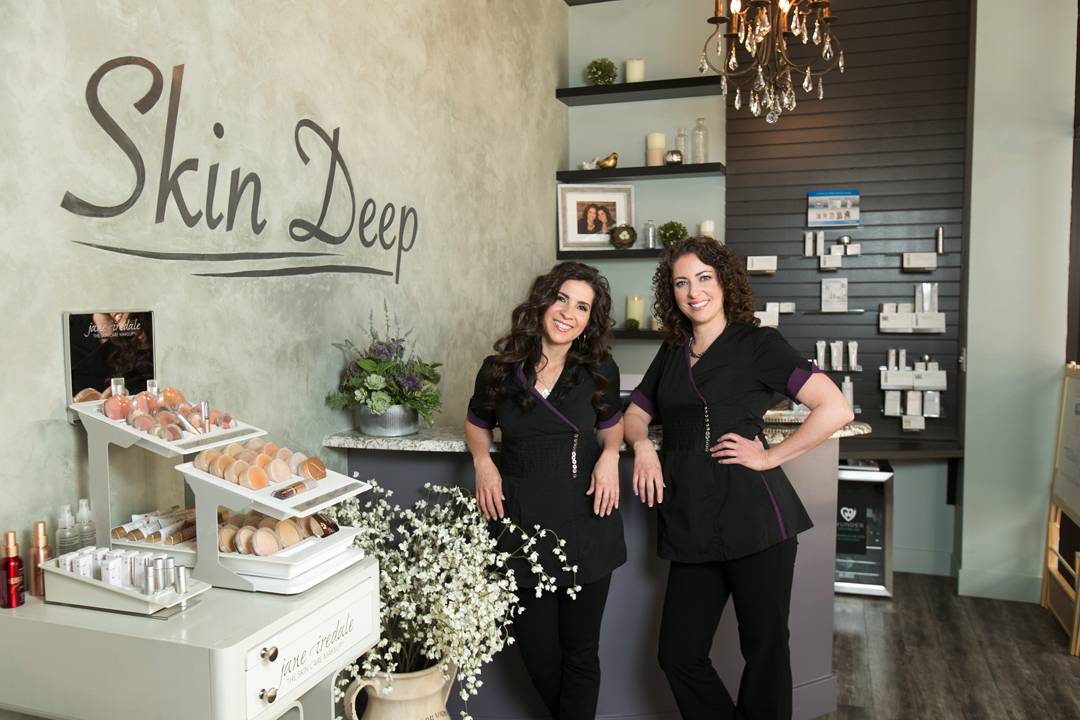 Brand photo of the owners of Skin Deep Spa (Fort Collins, CO) posing in the lobby of their business