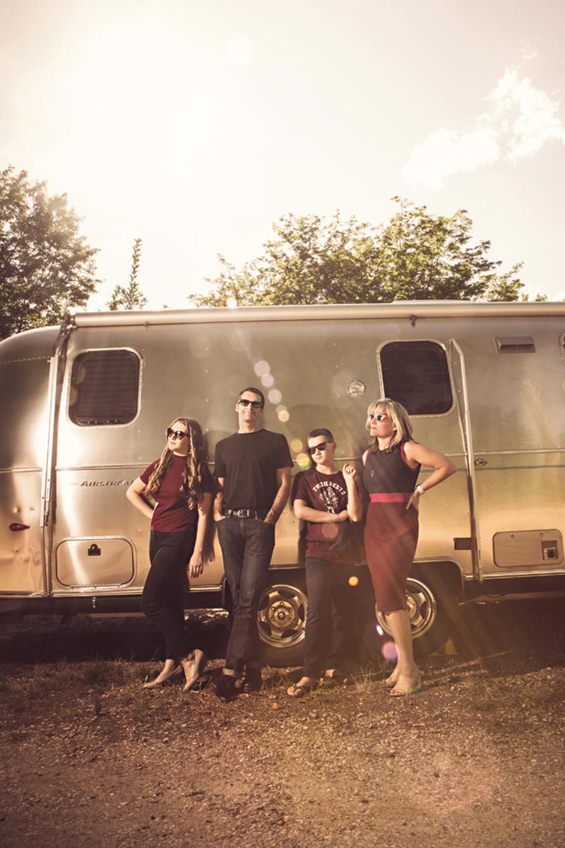 Family photo session in Colorado. Taken in front of the family's Airstream. Very Modern, stylized family photo image. By Desirée Suchy, Fort Collins Family Photographer