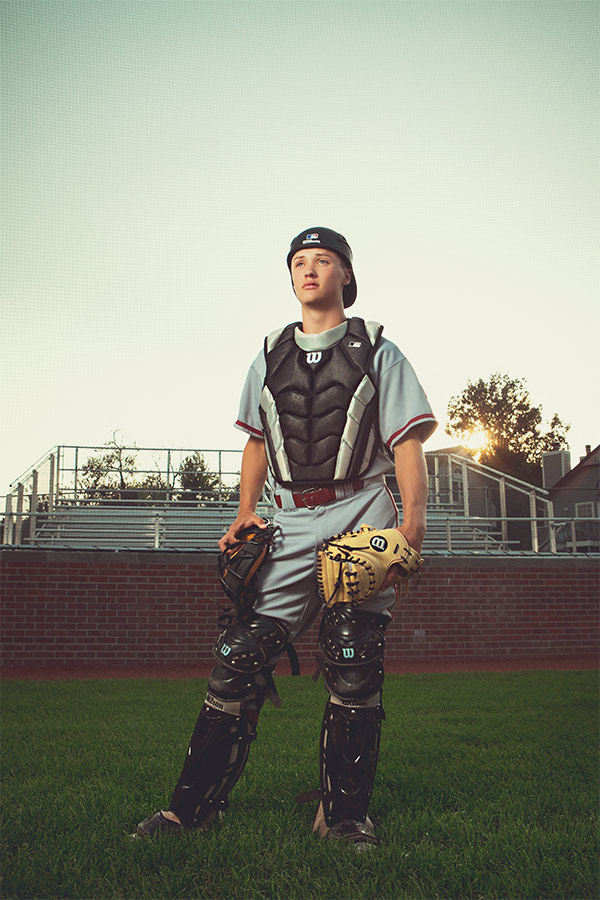 Dramatic sports-themed high school senior portrait of a baseball player for Rocky Mountain High School.